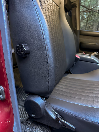 Black front seat with adjustable bolster
